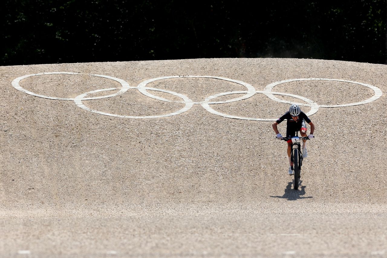 Great Britain's Thomas Pidcock races to the finish line to win gold in the men's cross country on day three of the Olympic Games in Elancourt today.