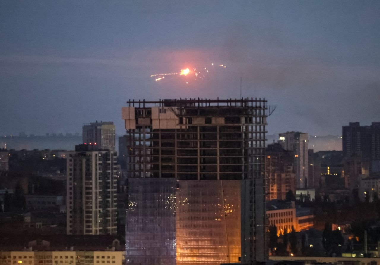 An explosion of a missile is seen in the sky over Kyiv on Thursday.