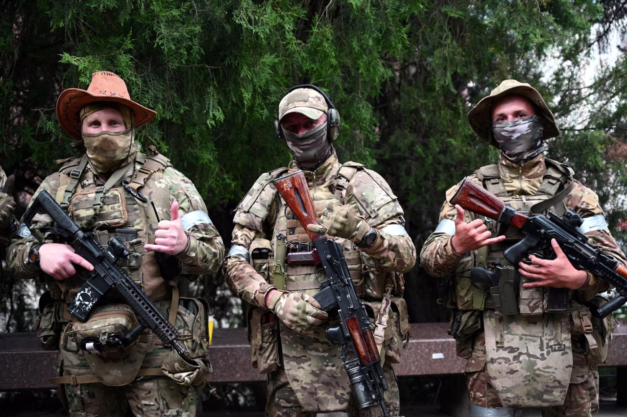 Wagner fighters pose for a picture as they get deployed near the headquarters of the Southern Military District in the city of Rostov-on-Don, Russia, on June 24.