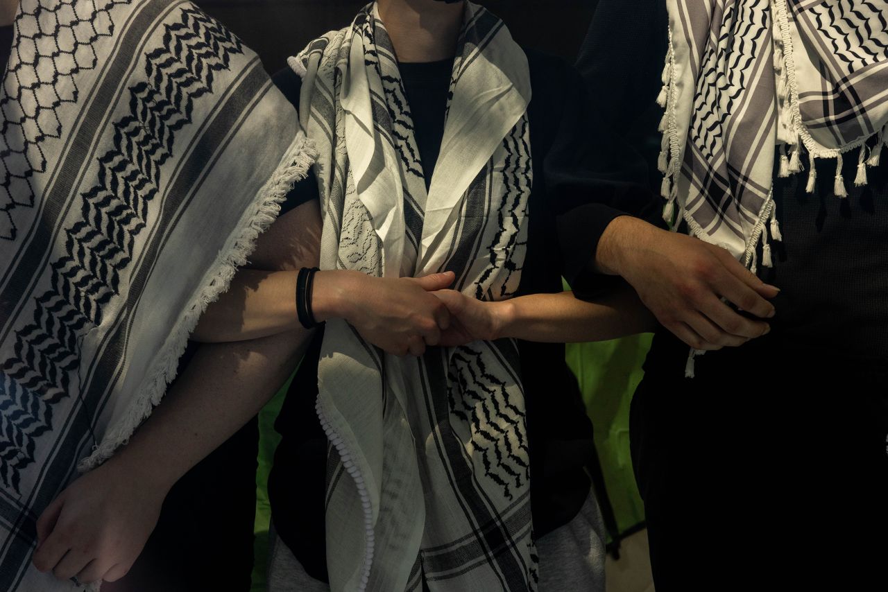 Pro-Palestinian protesters lock arms while occupying a building, where they had established an encampment, at Fordham University’s Lincoln Center campus in New York on May 1.