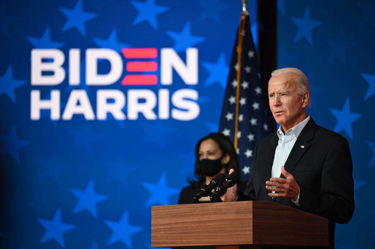 Democratic Presidential candidate Joe Biden speaks as Vice-Presidential candidate Kamala Harris looks on at the Queen venue in Wilmington, Delaware, on November 5.