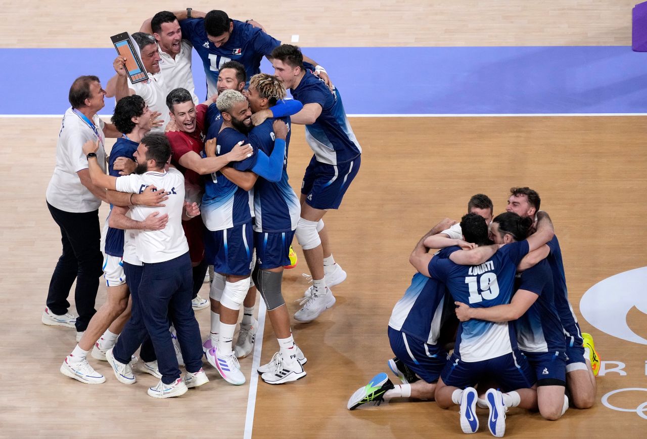 French players celebrate after winning the men's volleyball gold medal match against Poland on August 10. 