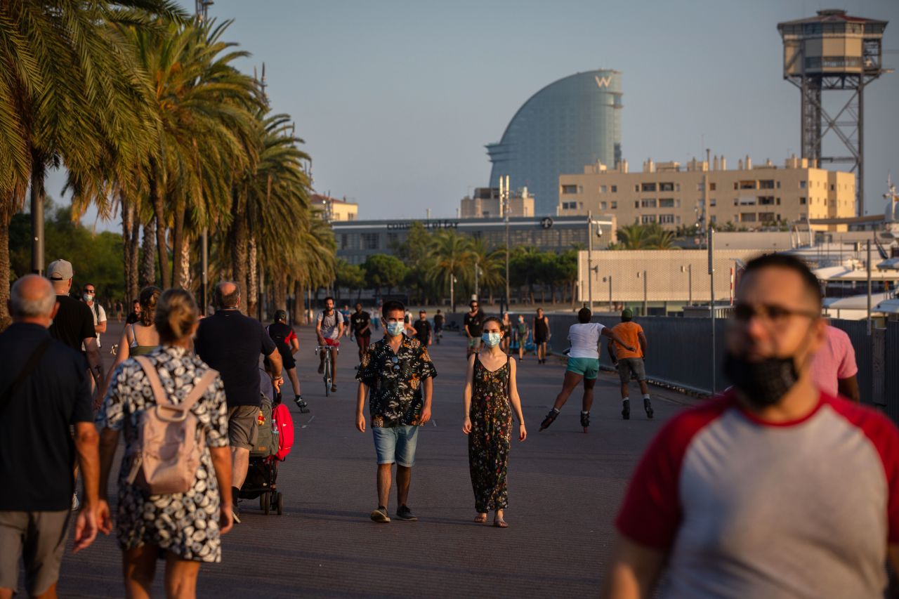 People walk in Barcelona, Spain, on July 28.