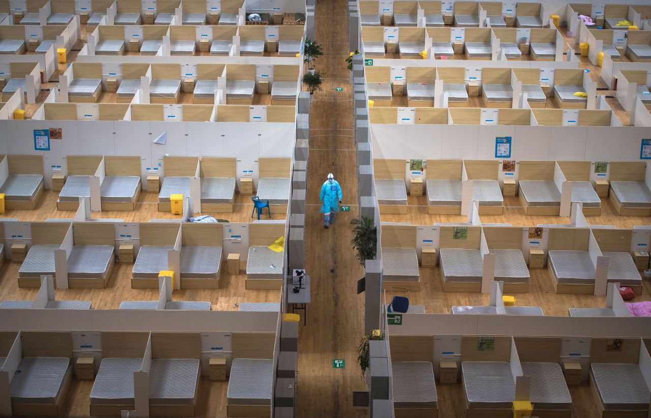 A staff member walks through an empty makeshift hospital in Wuhan after the last group of cured coronavirus patients were discharged on Sunday.