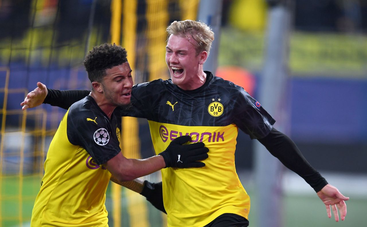 Julian Brandt of Borussia Dortmund celebrates after scoring his team's second goal with teammate Jadon Sancho.