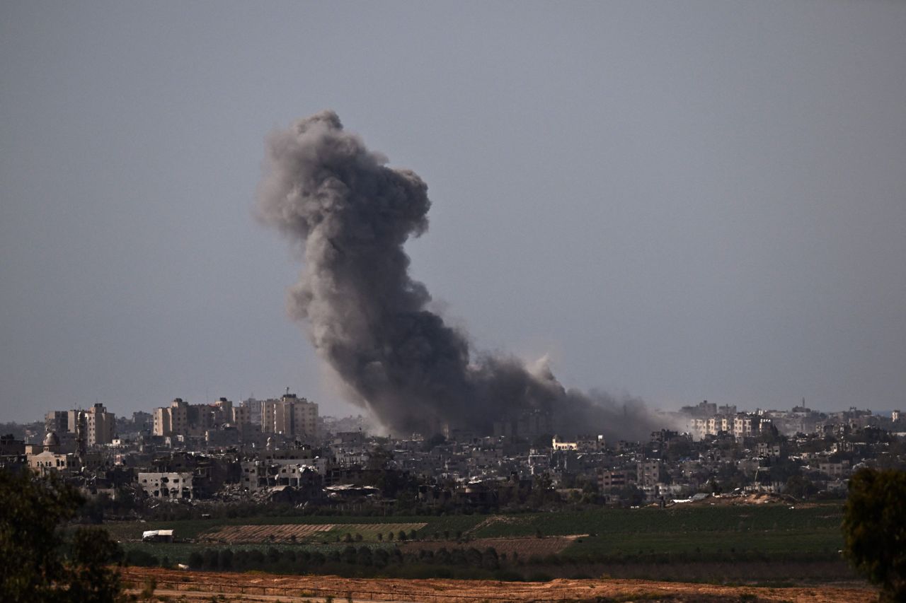 Smoke billows over northern Gaza following an Israeli strike, seen from the Israel-Gaza border, on October 21. 