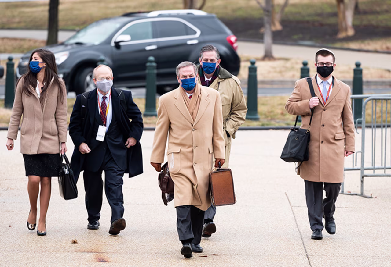  Members of former President Donald Trumps defense team, David Schoen, center left, Michael van der Veen, center, and Bruce Castor, center right, arrive at the Capitol before the start of day three of the impeachment trial in the Senate on Thursday, February 11.