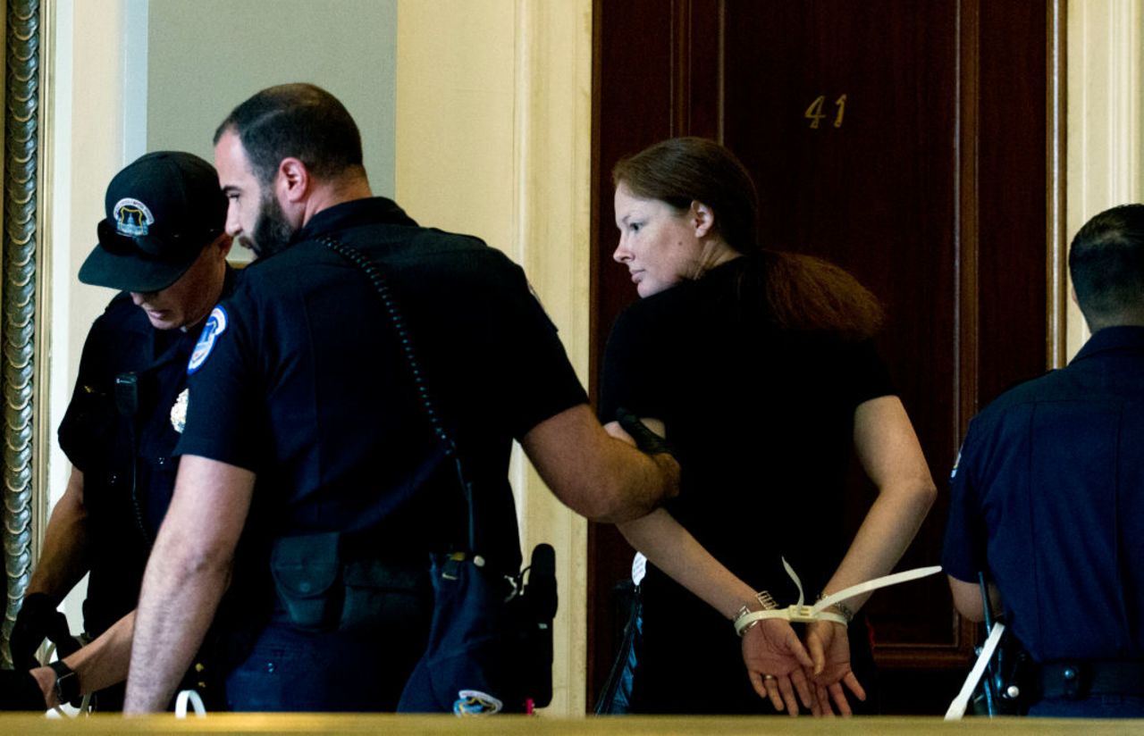 US Capitol Police arrest demonstrators blocking the office door of Sen. Jeff Flake (R-AZ) protesting against the appointment of Supreme Court nominee Brett Kavanaugh at Russell Senate Office Building in Washington DC, on Oct. 5, 2018. 