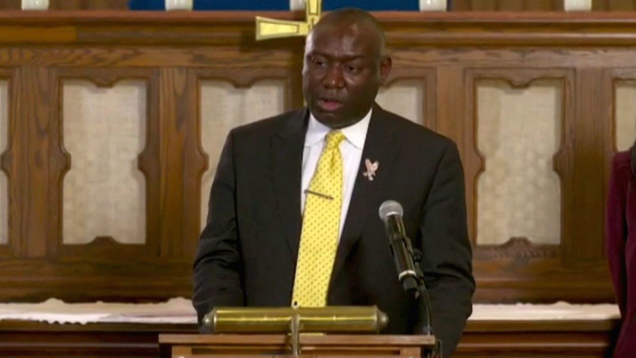 Floyd family attorney Ben Crump holds a news conference on Monday.