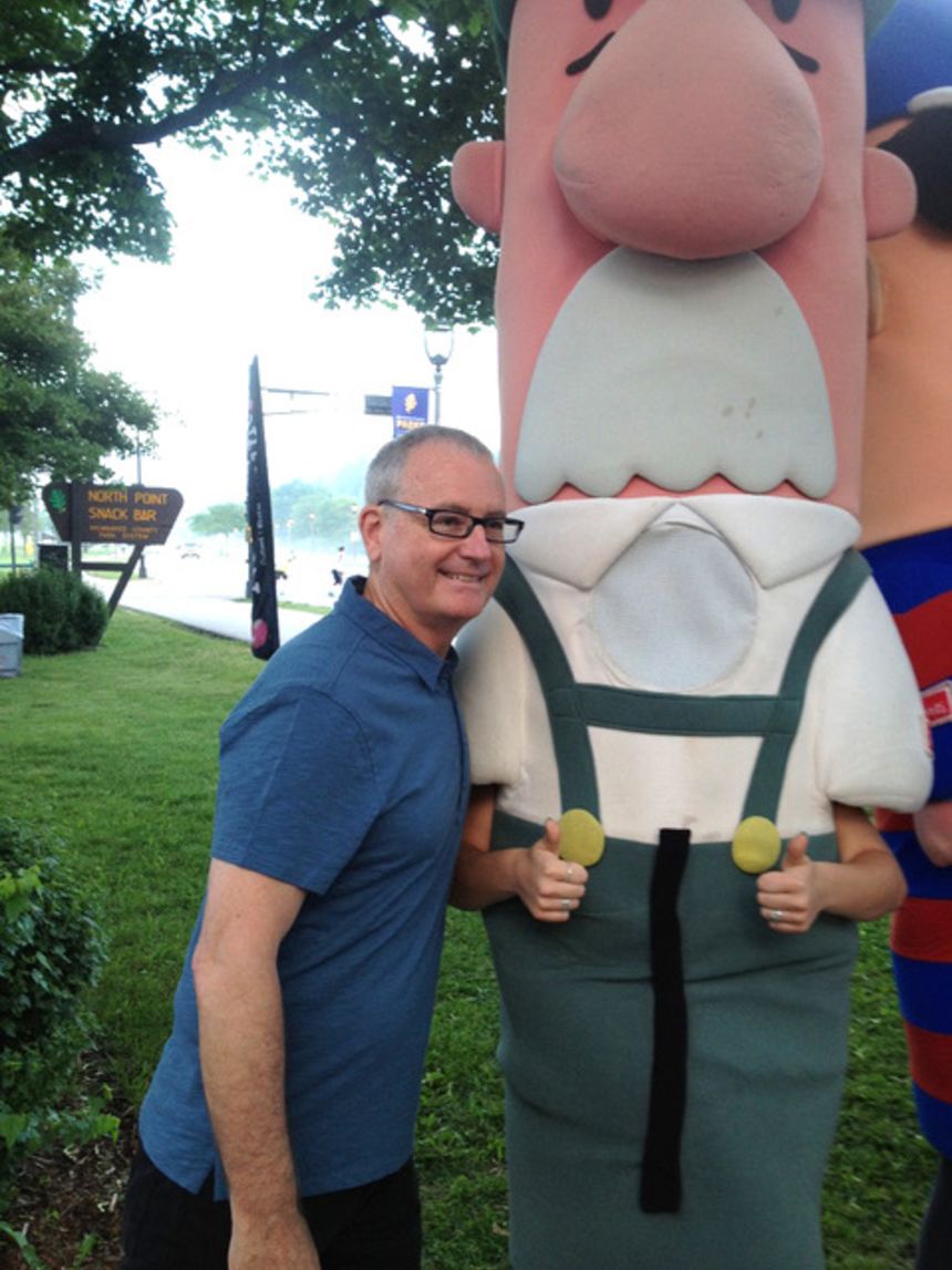 Michael Dillon poses with Bratwurst at the racing sausages' 20th anniversary.