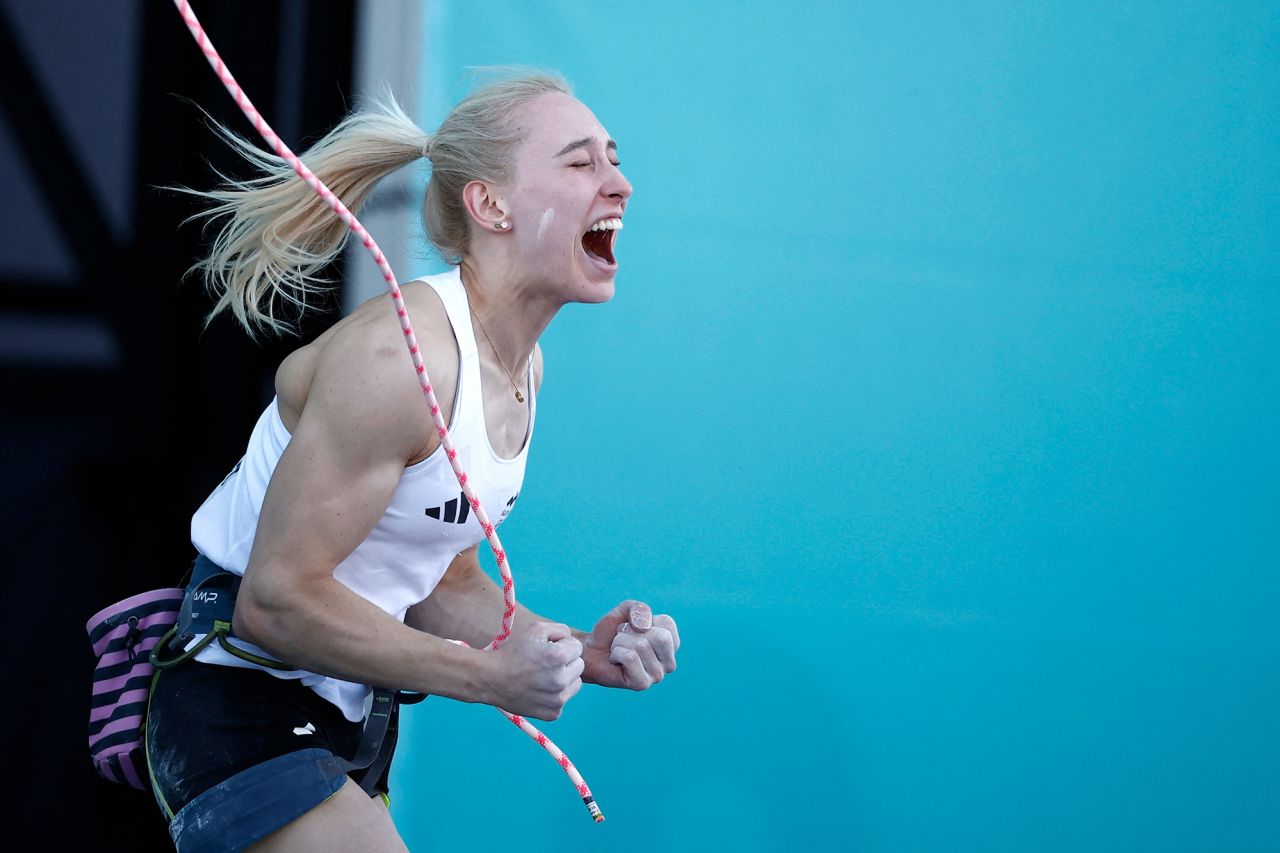 Janja Garnbret of Slovenia celebrates after winning the gold in women's boulder and lead climbing on Saturday, August 10. 