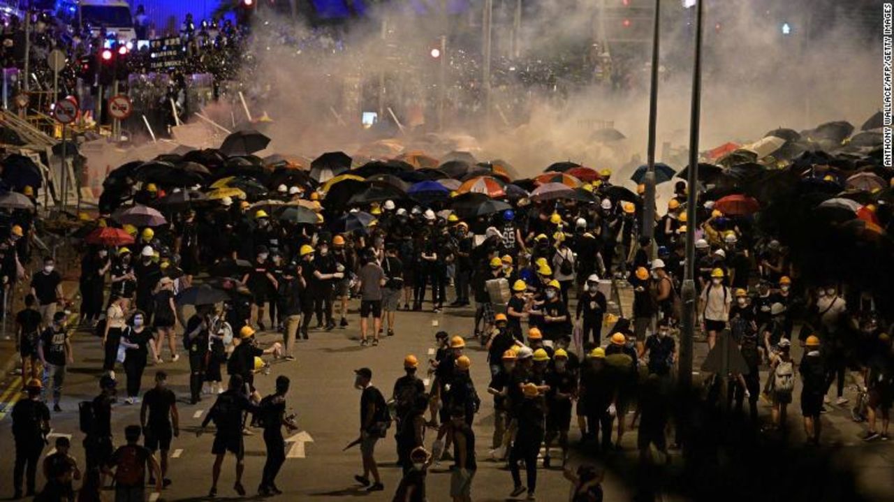 Police fire tear gas at protesters near the government headquarters in Hong Kong on July 2, 2019, on the 22nd anniversary of the city's handover from Britain to China. 