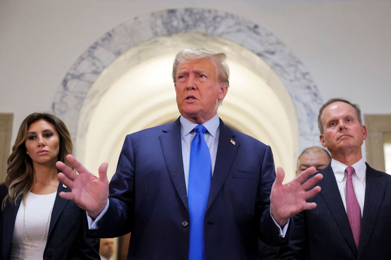 Former President Donald Trump speaks to the media as he arrives at a Manhattan courthouse, for the trial of himself, his adult sons, the Trump Organization and others in a civil fraud case brought by state Attorney General Letitia James, in New York City, on Monday.