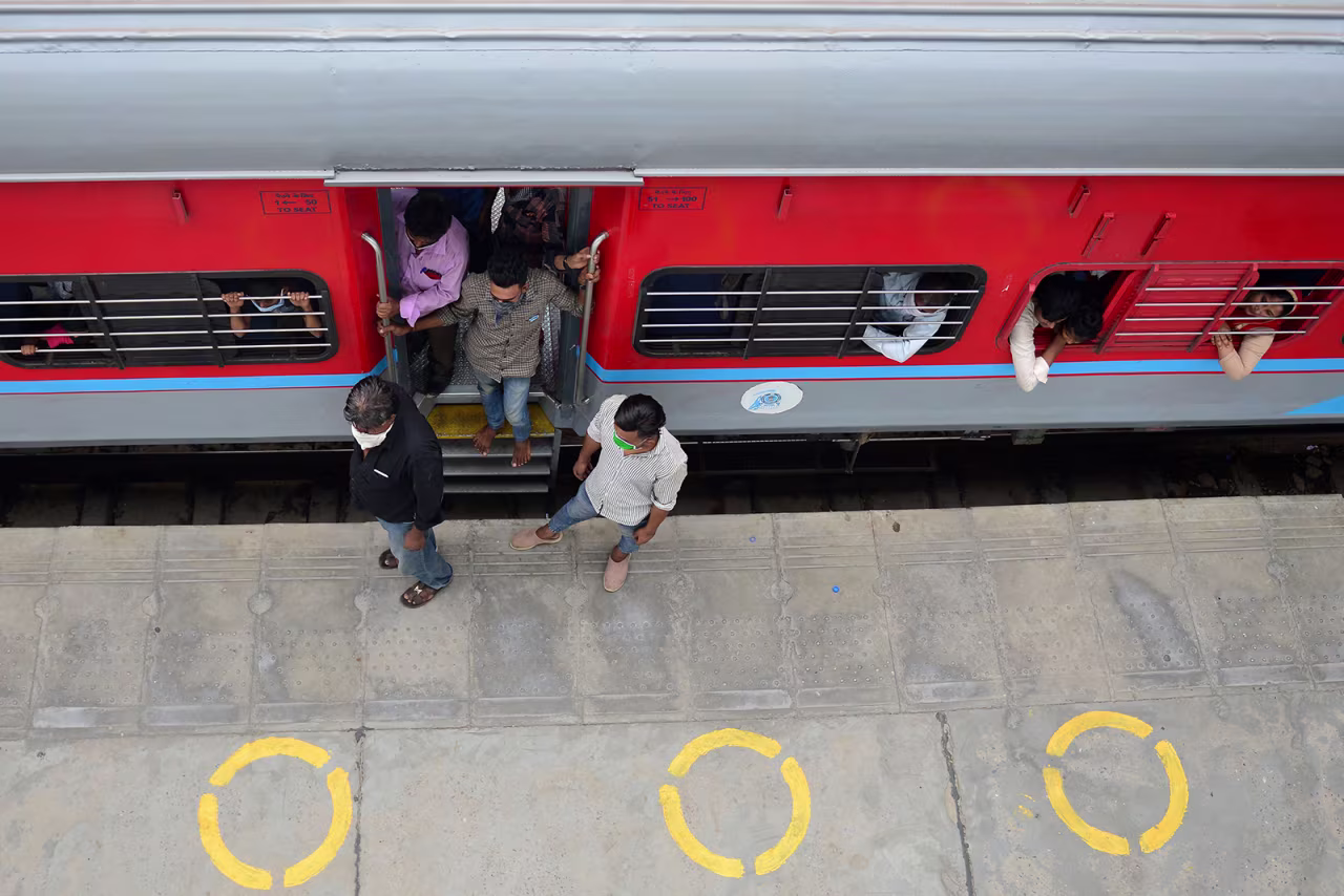 Passengers arrive from Mumbai at the railway station in Allahabad, India on May 30.