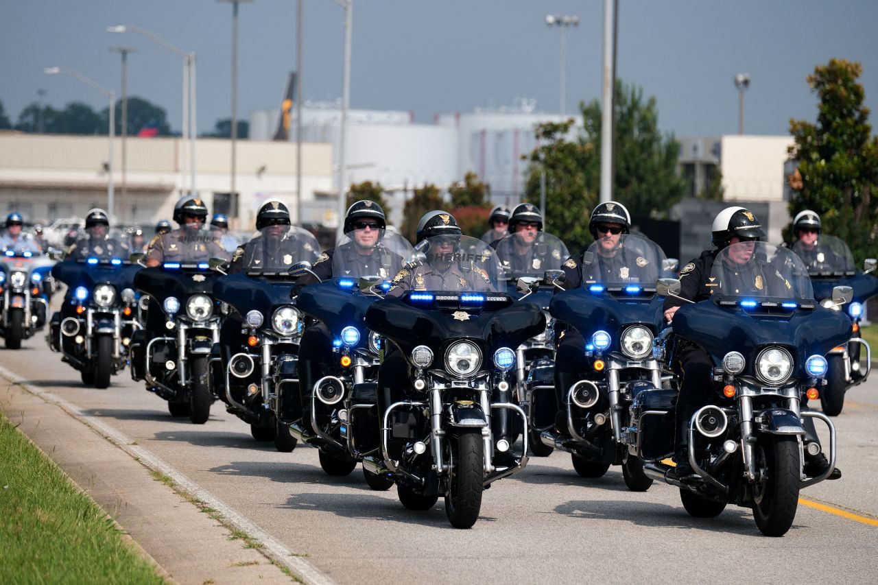 Law enforcement officers drive near Atlanta Hartsfield-Jackson International Airport in Atlanta, Georgia, on Thursday.