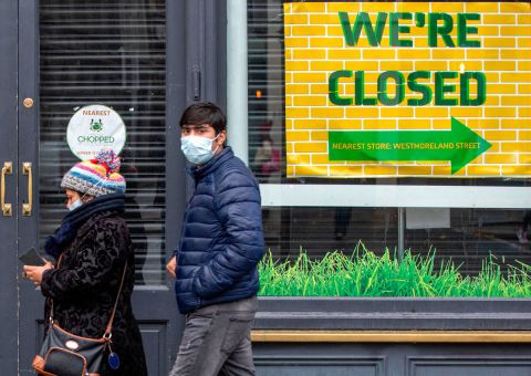 Pedestrians wearing face masks are seen in Dublin, Ireland on October 19.