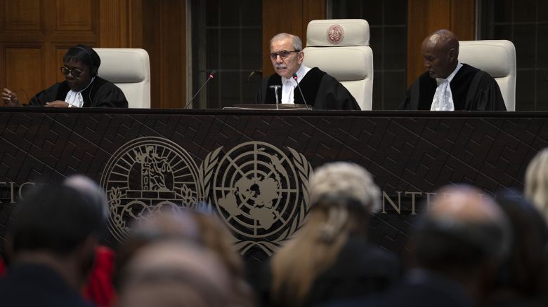 Presiding Judge Nawaf Salam, center, reads the ruling of the International Court of Justice, or World Court, in The Hague, Netherlands, Friday, May 24, 2024, where the top United Nations court ruled on an urgent plea by South Africa for judges to order Israel to halt its military operations in Gaza and withdraw from the enclave. (AP Photo/