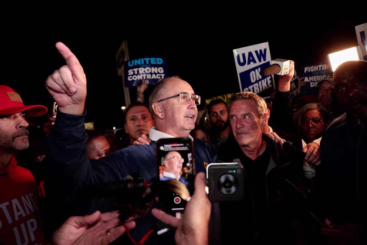 United Auto Workers union President Shawn Fain joins UAW members who are on a strike at the Ford Michigan assembly plant in Wayne, Michigan, on the morning of September 15.
