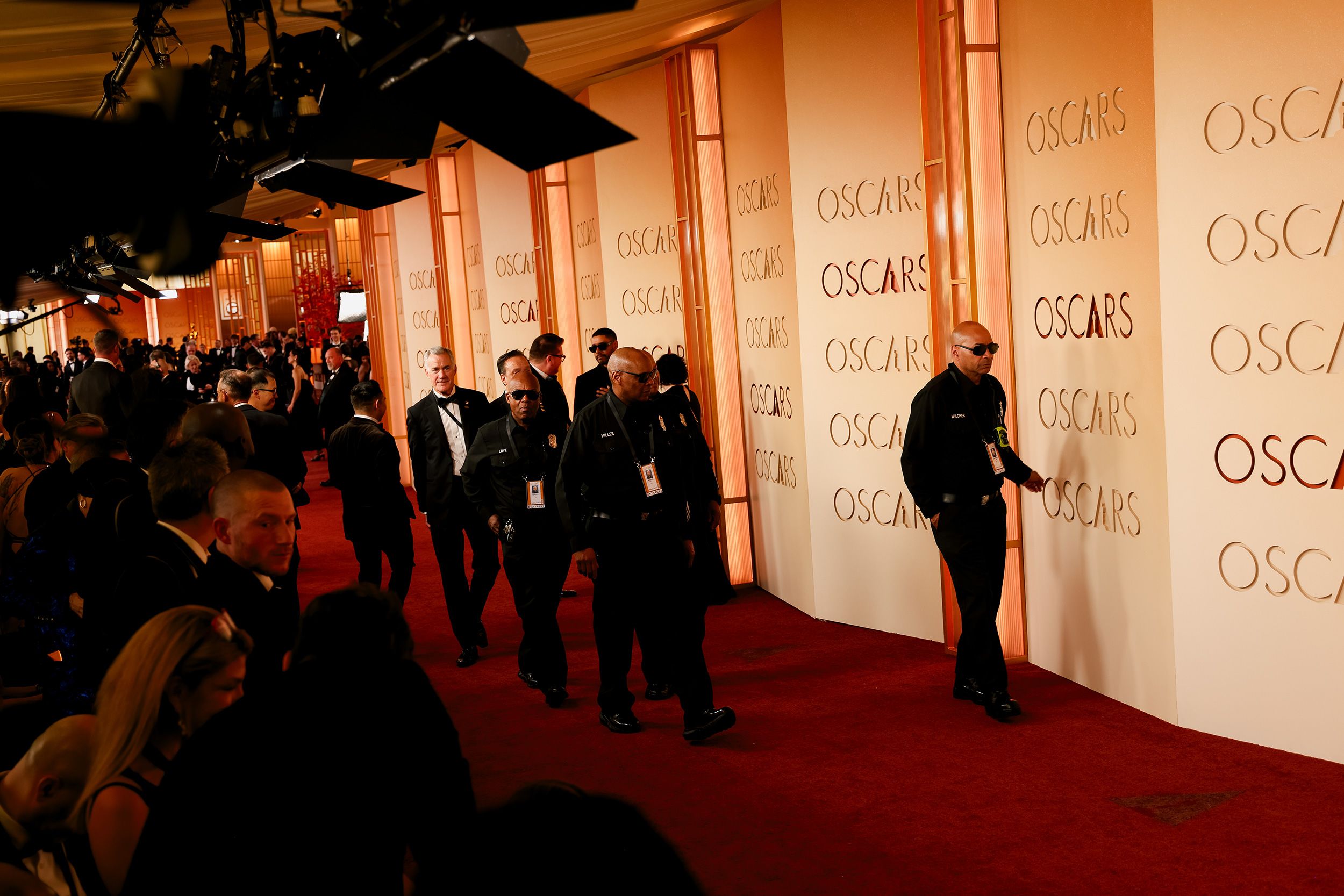 Security personnel walk the red carpet ahead of the show.