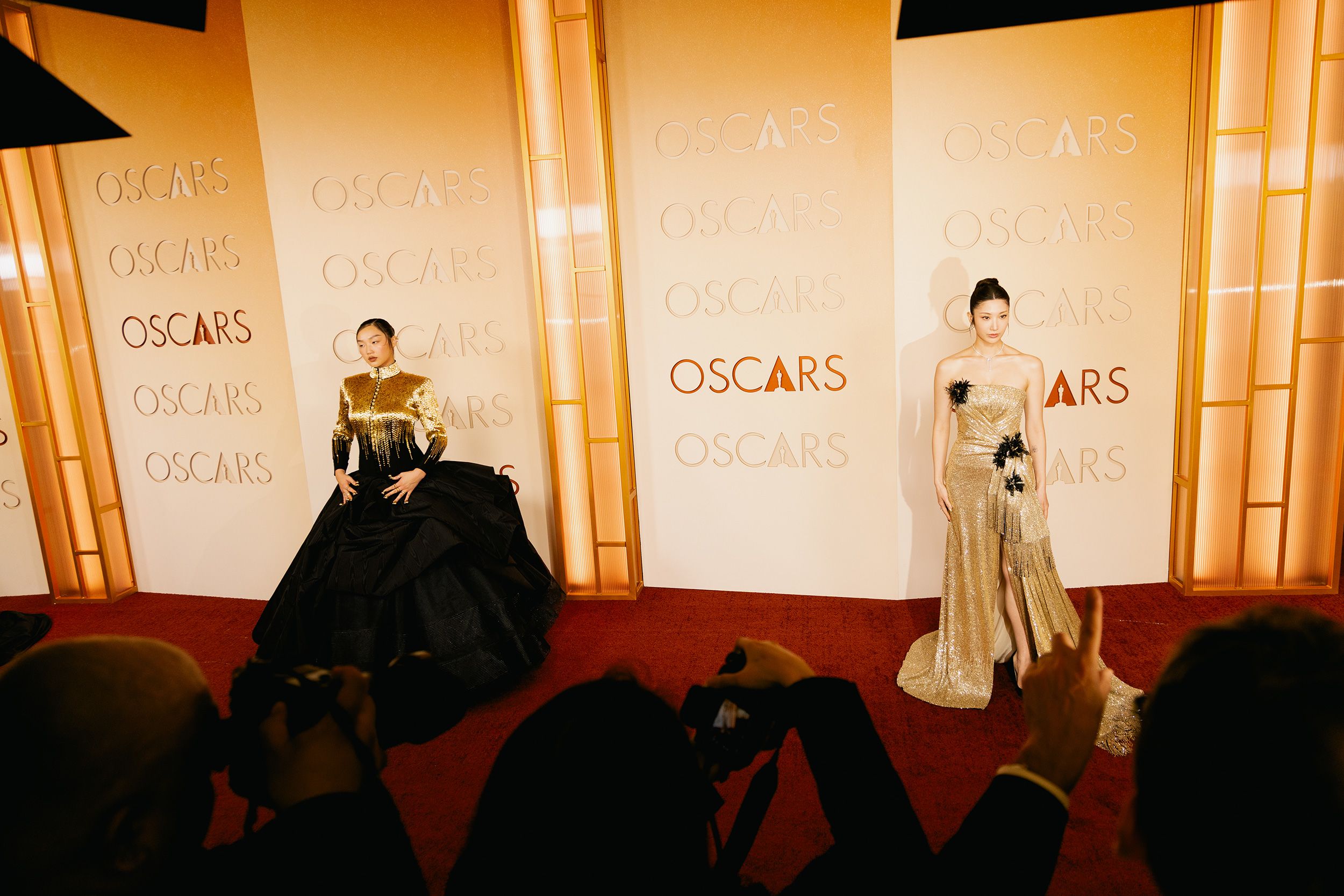 "KPop Demon Hunters" stars Audrey Nuna, left, and Ejae land on the red carpet ahead of their performance of "Golden," which later won best original song.