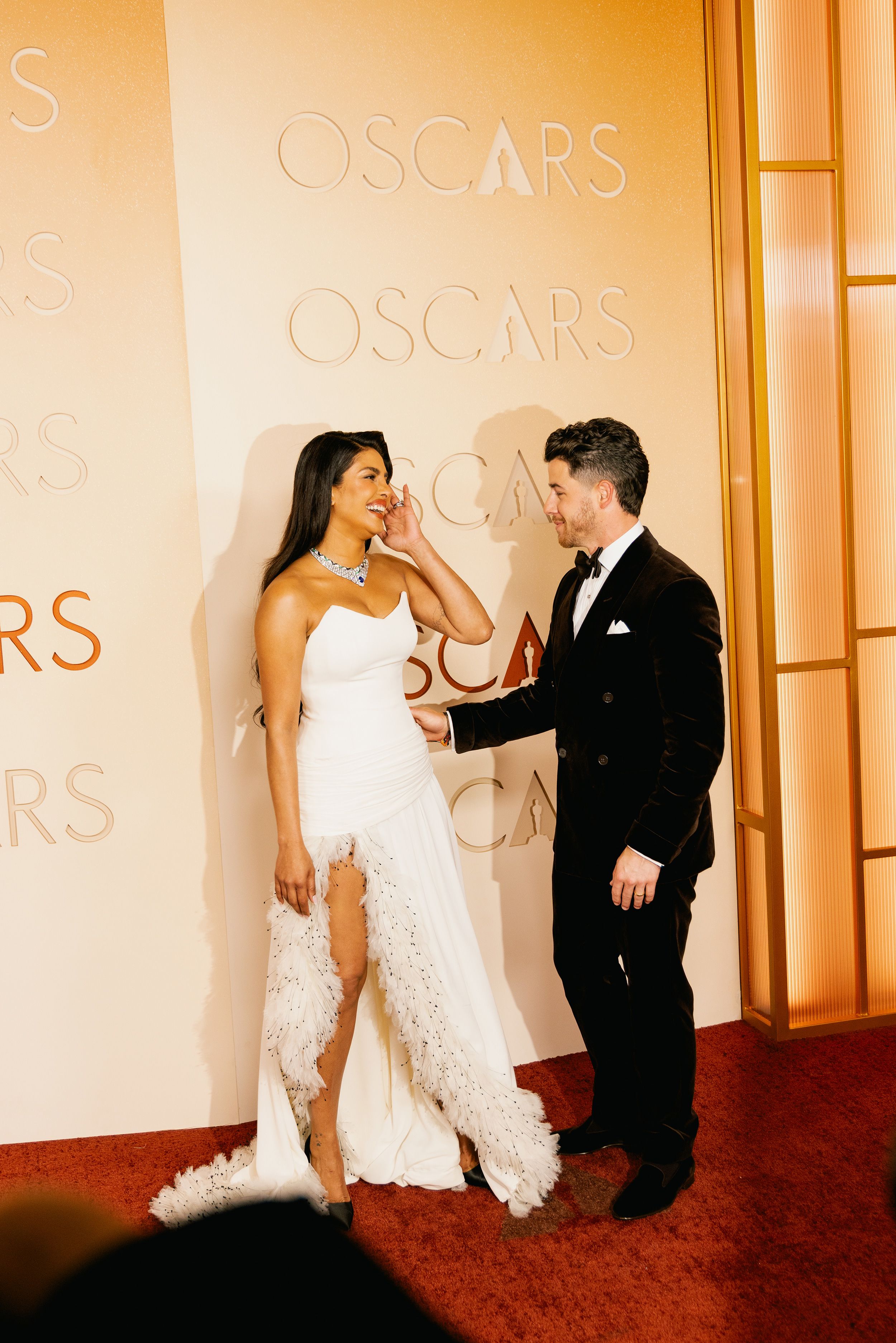 Priyanka Chopra and Nick Jonas in Dior and Ralph Lauren, respectively.