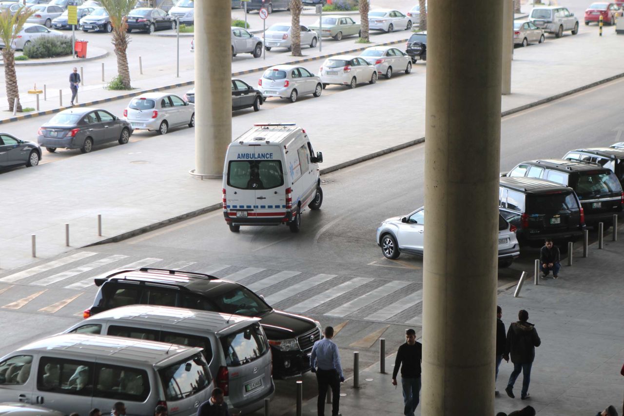 An ambulance carrying a patient leaves the Queen Alia International Airport in Amman, Jordan, on March 16, in the final hours before the closure of Jordan's borders.