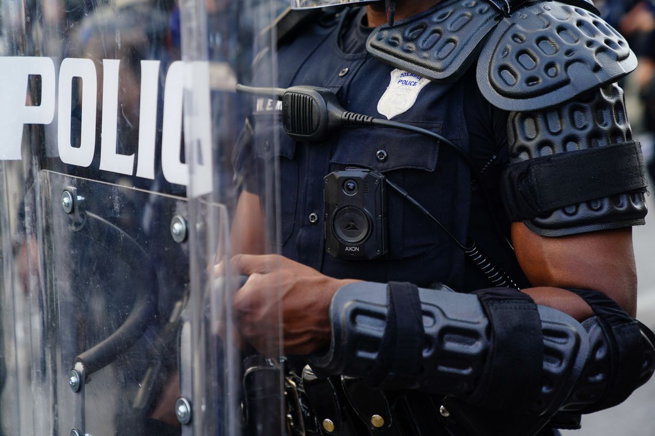 A police officer wearing a body cam is seen during a demonstration on May 31 in Atlanta. 