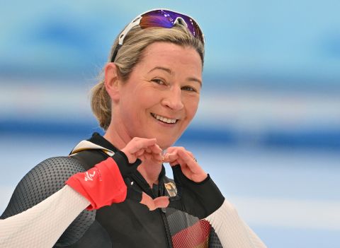Claudia Pechstein of Germany celebrates and makes a heart with her hands after the women's 3,000m speed skating event on Feb. 5