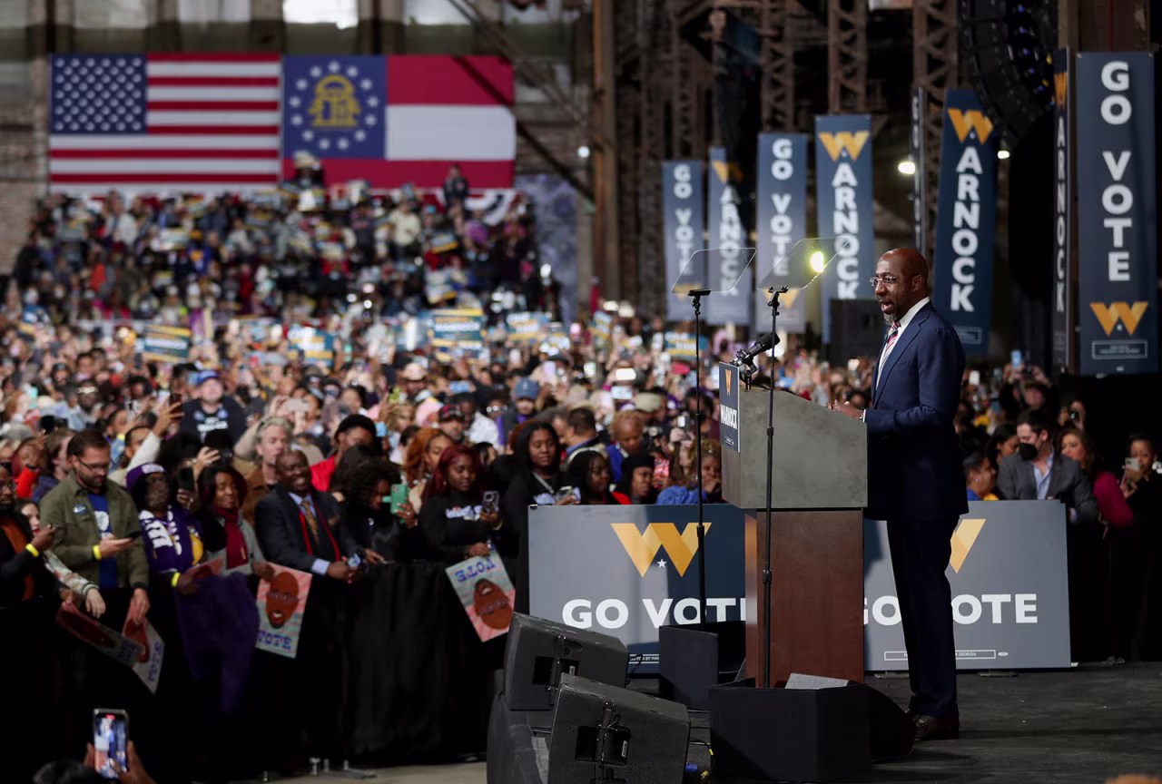 Democratic Sen. Raphael Warnock speaks during a rally in Atlanta on December 1. 