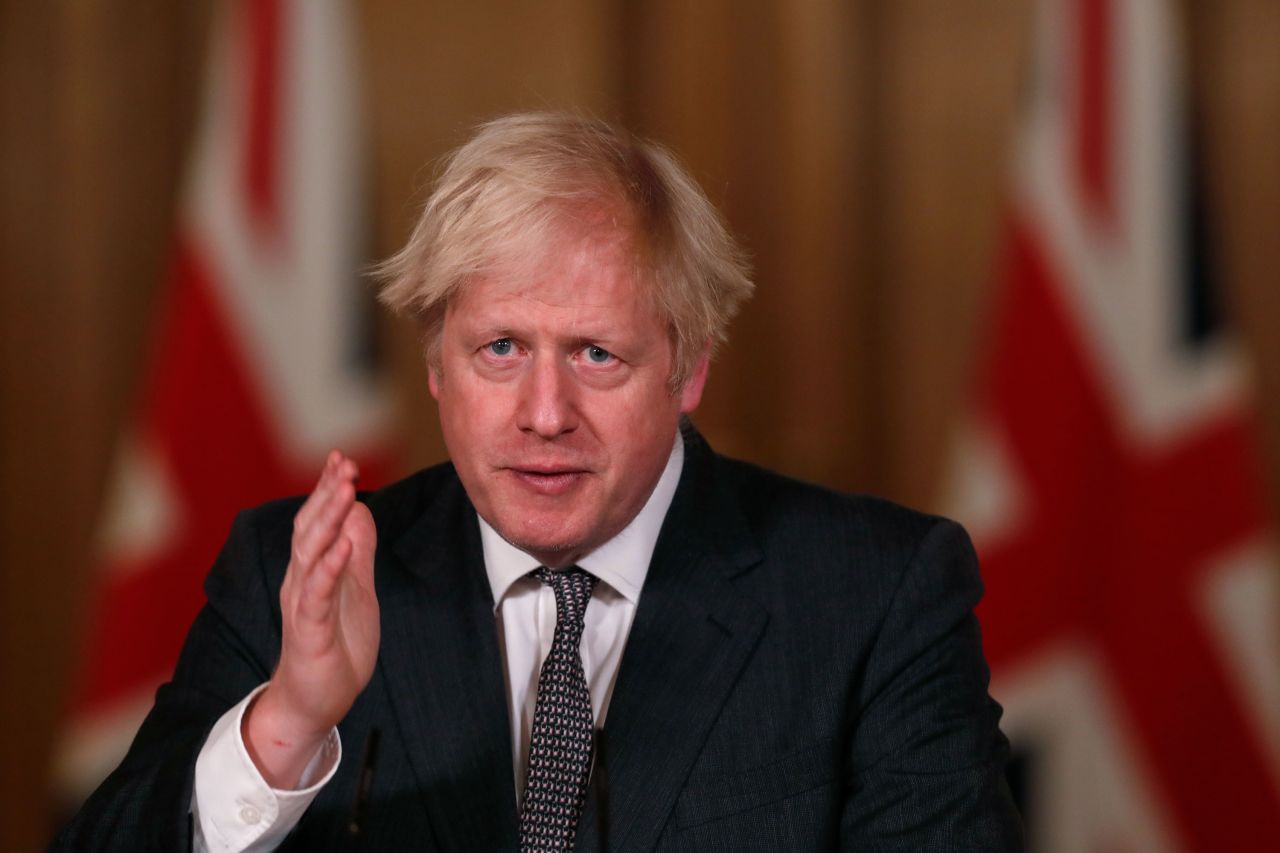 UK Prime Minister Boris Johnson speaks during a press conference in London on December 30, 2020.