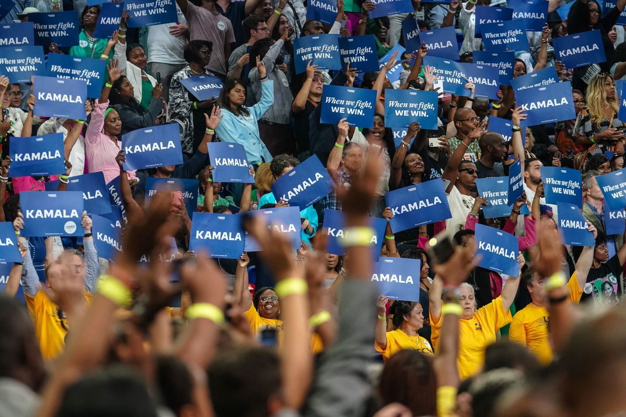 Supporters wave signs during a campaign rally for Vice President Kamala Harris in Atlanta, on July 30.