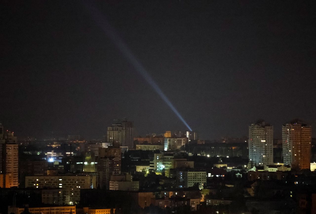 Ukrainian forces use a searchlight to scan the sky during a Russian drone strike in?Kyiv, Ukraine, on July 25. 