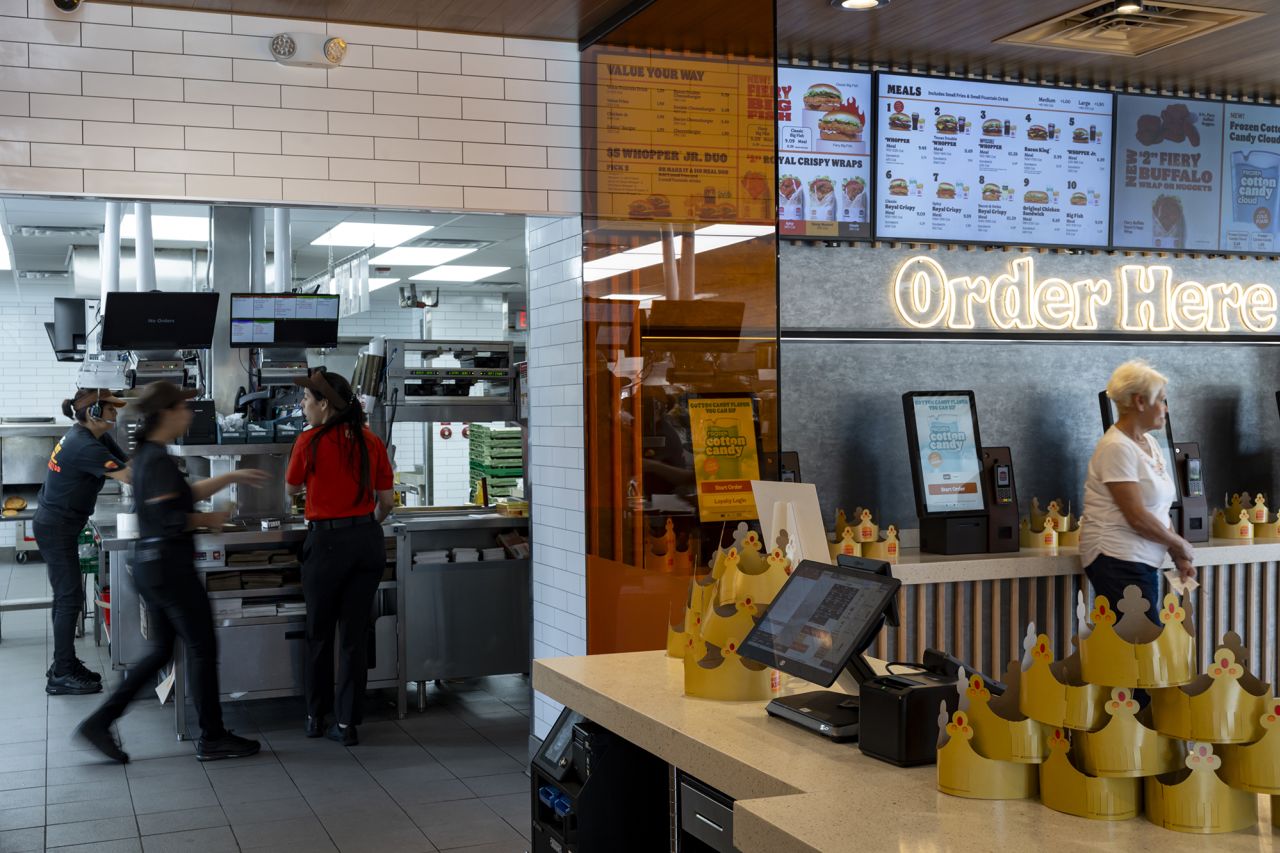 Workers prepare food orders at a Burger King fast food restaurant in Hialeah, Florida, on April 18.