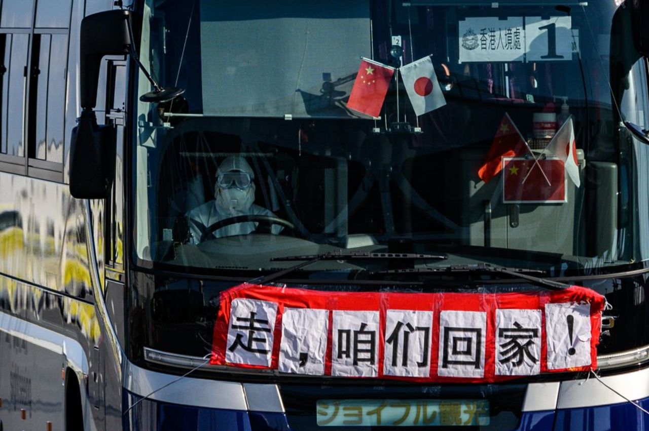 A bus waits for passengers at the Daikoku pier cruise terminal in Yokohama on February 21, 2020.