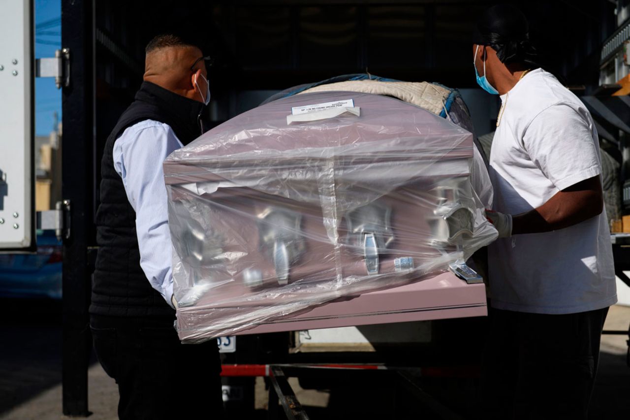 An empty casket is delivered amid a surge of Covid-19 deaths to the Continental Funeral Home on December 31, 2020 in East Los Angeles, California.