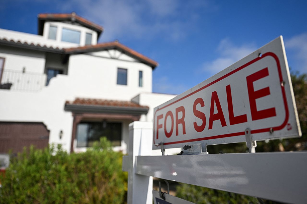 A for sale sign is displayed outside of a home for sale on August 16 in Los Angeles, California. 