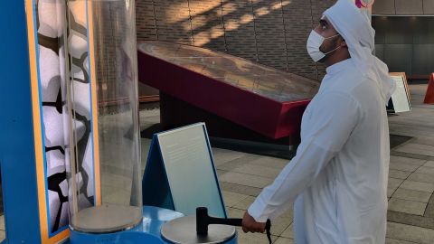 Saeed Al Kaabi, 25, from the UAE, interacts with an exhibit in the Sustainability pavilion.