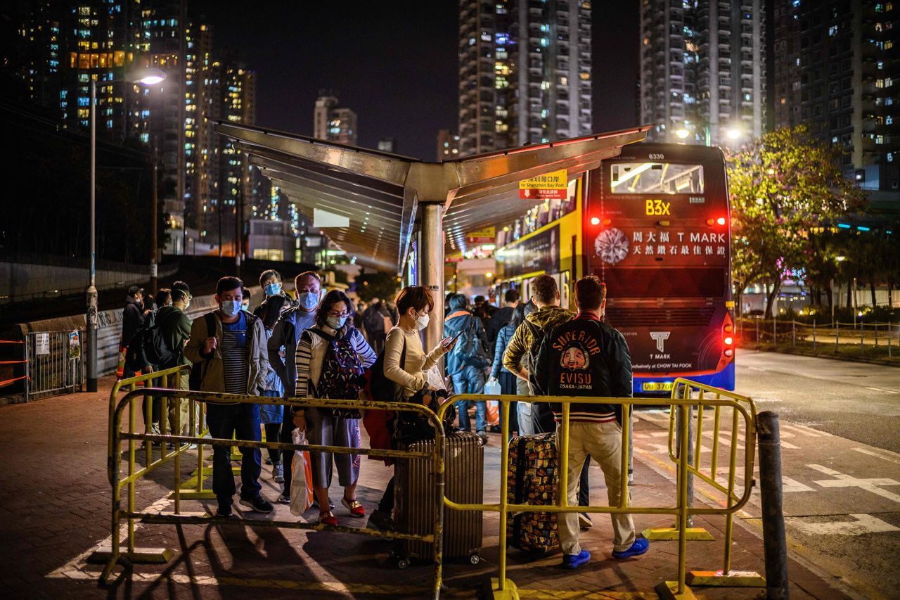 Passengers line up to board a bus from Tuen Mun in Hong Kong to Shenzhen on February 6.