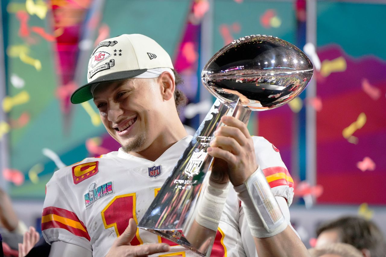 Kansas City Chiefs quarterback Patrick Mahomes holds the Lombardi Trophy after winning Super Bowl LVII.