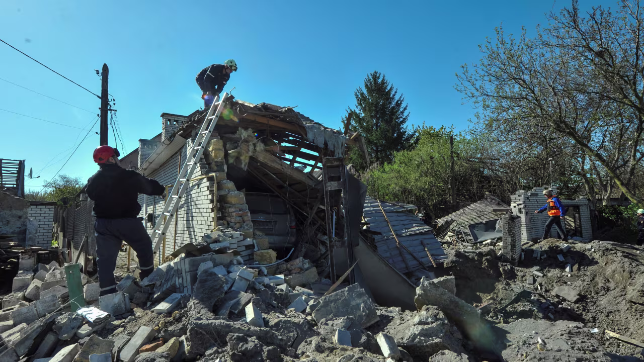Rescuers work at the site of a residential area heavily damaged by a Russian missile strike, amid Russia's attack on Ukraine, in Zaporizhzhia, Ukraine on May 3, 2023.
