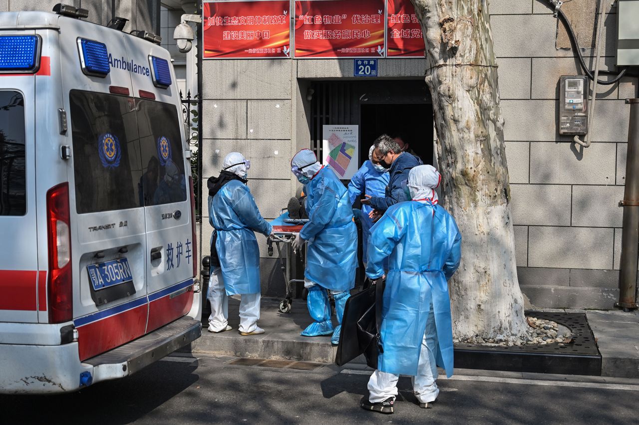 Medical staff in protective clothes are seen carrying a patient from an apartment suspected of having the virus in Hubei province on January 30, 2020.