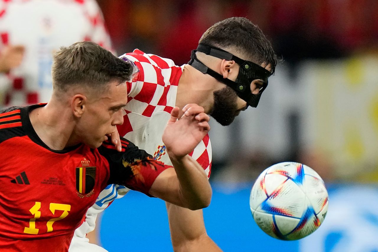 Belgium's Leandro Trossard, left, and Croatia's Josko Gvardiol fight for the ball.