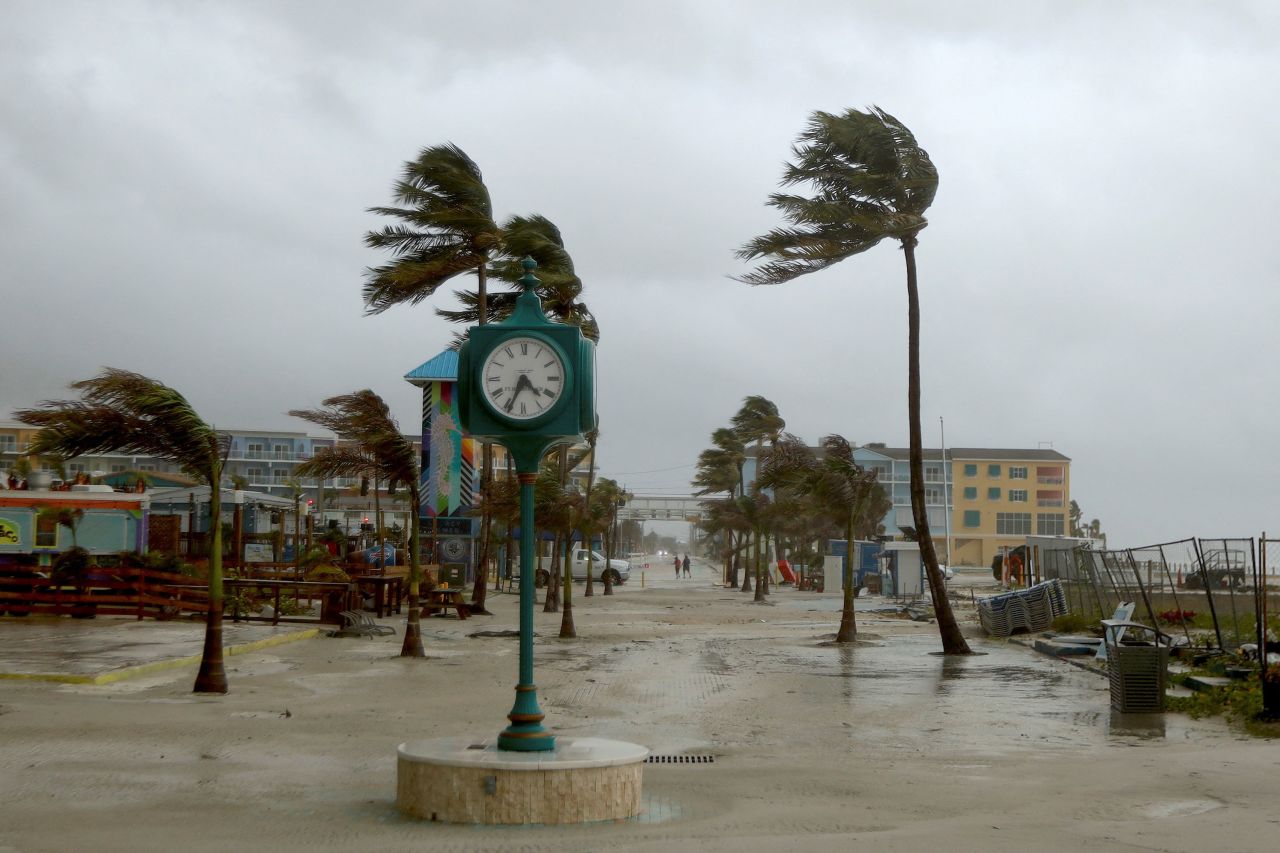 Palm trees blow from Tropical Storm Debby's bands in Ft. Myers Beach, Florida, on August 4.