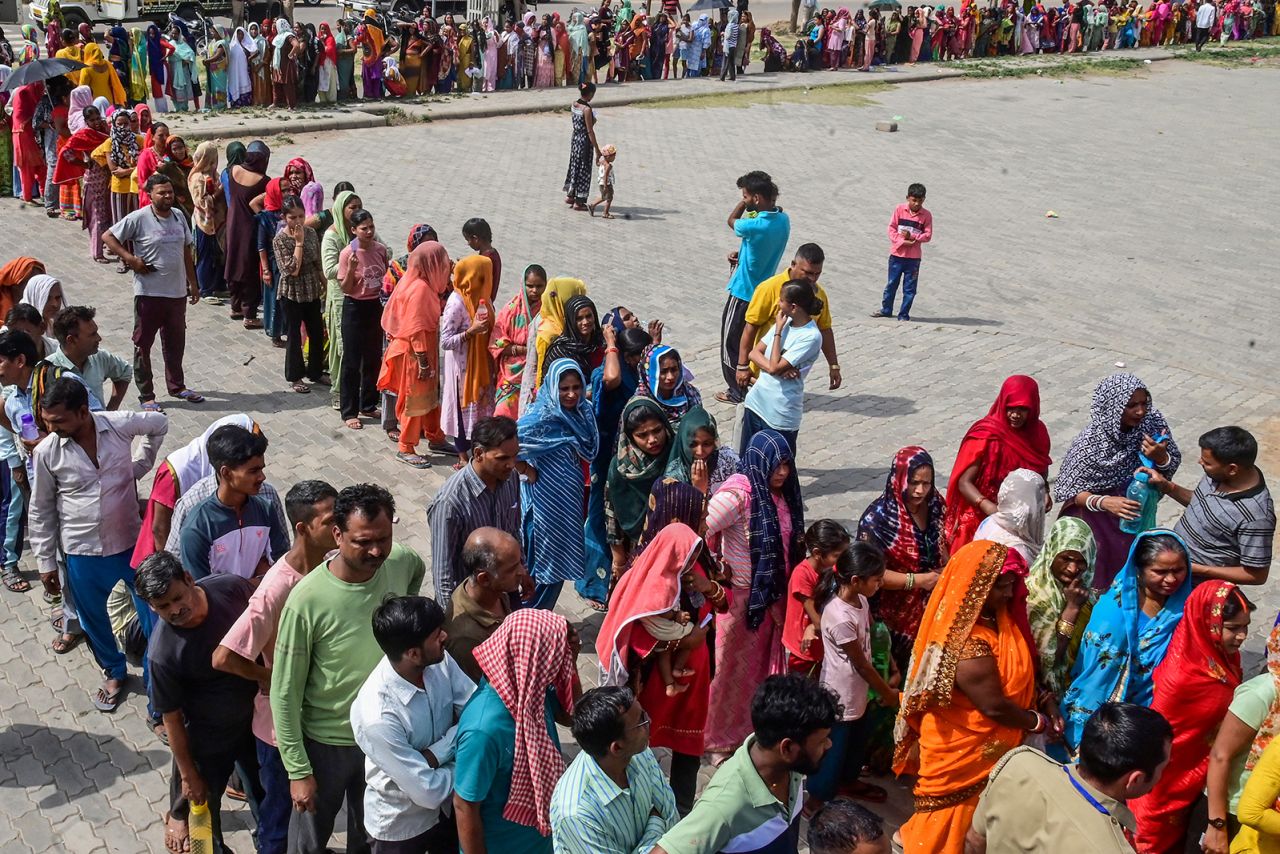 Voters queue up to cast their ballots at a polling station during the seventh and final phase of voting in India's general election in Chandigarh on June 1.