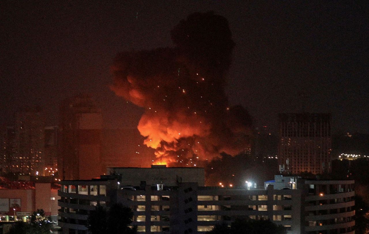 An explosion is seen in the sky over the city during a Russian missile strike in Kyiv, Ukraine, on August 30.