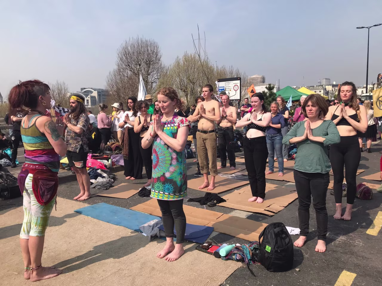 Demonstrators take part in a yoga session on Waterloo Bridge in London on Wednesday. 