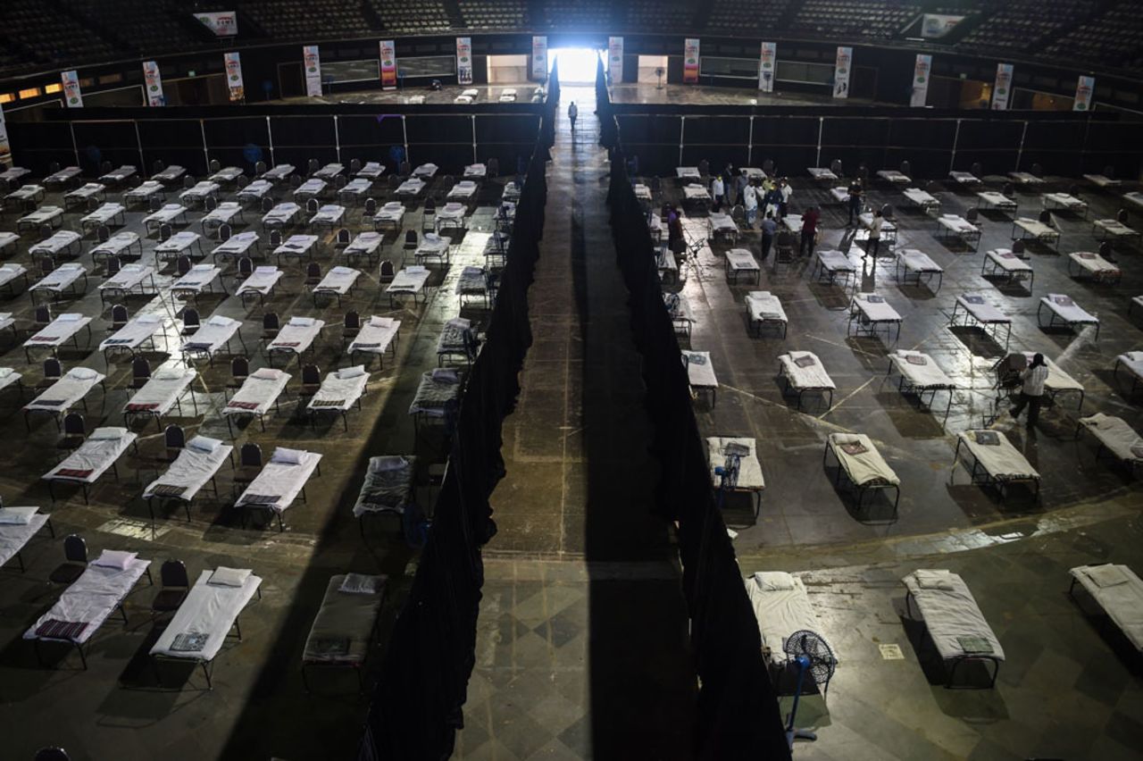 Bombay Municipal Corporation workers prepare an isolation centre at the NSCI dome during a government-imposed nationwide lockdown in Mumbai on April 9.