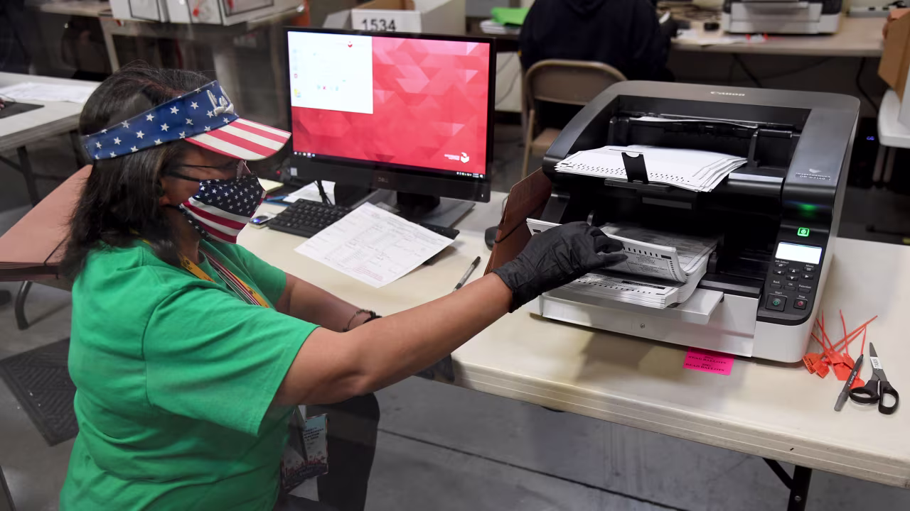 A Clark County election worker scans mail-in ballots on November 7 in North Las Vegas, Nevada. 