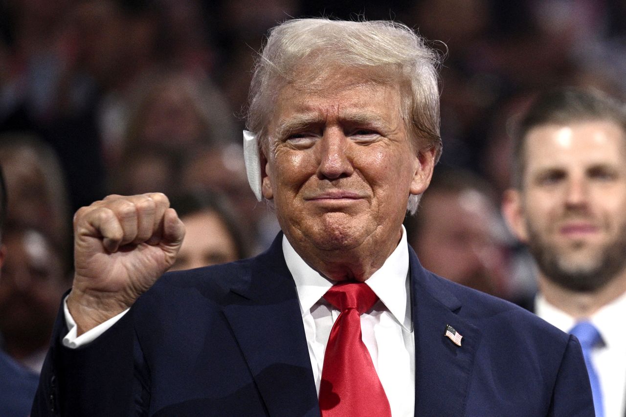 US former President and 2024 Republican presidential candidate Donald Trump raises a fist during the first day of the 2024 Republican National Convention at the Fiserv Forum in Milwaukee, Wisconsin, on July 15.