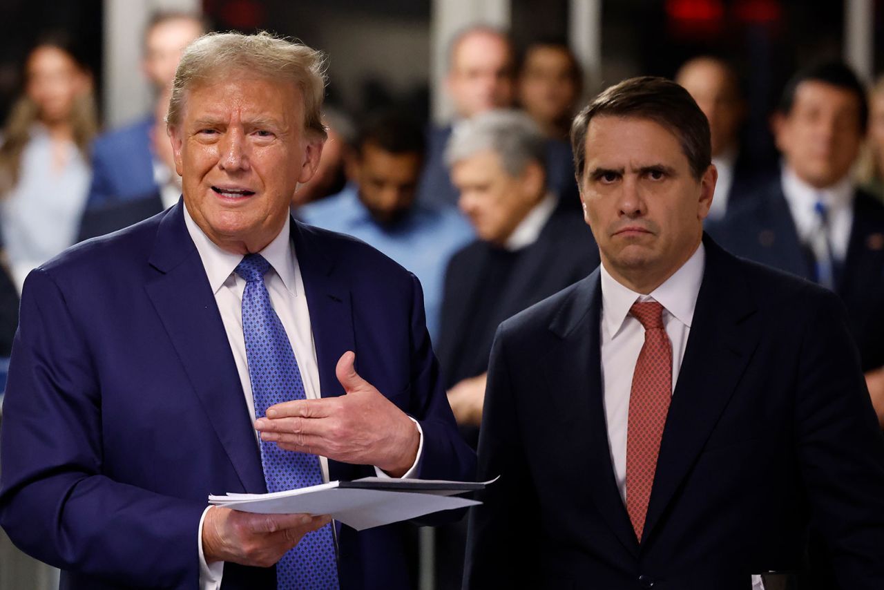 Former US President Donald Trump and attorney Todd Blanche speak to the press before departing Manhattan criminal court in New York, on Monday, May 20.